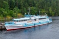 White cruise ship moored at the pier in the Bolshaya Nikonovskaya Bay on the island of Valaam Royalty Free Stock Photo