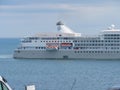 A white cruise ship sailing off the English coast near Falmouth