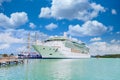 White Cruise Ship by Wood Masts Royalty Free Stock Photo