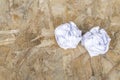 White Crumple paper ball on old wood table Royalty Free Stock Photo