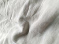 White crumpled bedsheet background