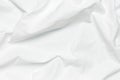 White crumpled natural cotton fabric top view. Natural linen background. Eco textiles. White Fabric texture. Fabric