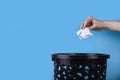 White crumpled paper beacons are thrown in the trash can Royalty Free Stock Photo