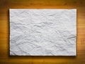 White Crumpled Paper on Wood Background Royalty Free Stock Photo