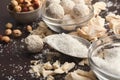 Crushed white chocolate pieces and truffles on gray background Royalty Free Stock Photo