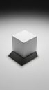 A White Cube Box with Dramatic Shadow on a Light Gray Background Royalty Free Stock Photo