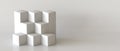 White cube boxes with white blank wall background. Royalty Free Stock Photo