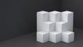 White cube boxes with dark blank wall background for display. 3D rendering. Royalty Free Stock Photo