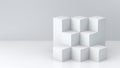 White cube boxes with white blank wall background for display. 3D rendering. Royalty Free Stock Photo