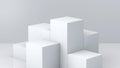 White cube boxes with white blank wall background for display. 3D rendering. Royalty Free Stock Photo