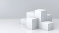 White cube boxes with white blank wall background for display. 3D rendering.