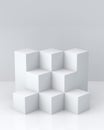 White cube boxes with white blank wall background for display. 3D rendering. Royalty Free Stock Photo