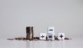 White cubes with arithmetic symbols and pile of coins. Royalty Free Stock Photo