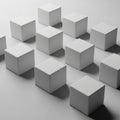 White cubes arranged in a grid pattern on a light gray surface Royalty Free Stock Photo