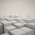 White cubes are arranged in a staggered pattern, creating a geometric landscape. Royalty Free Stock Photo