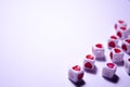 White cubes with red hearts. The 14th of February. White background and cubes side view. Dice beads. White background Royalty Free Stock Photo