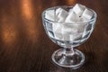 White cubes of sugar in a glass bowl