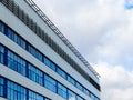 White cumuli clouds and modern factory building