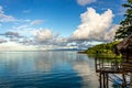 White Cumulostratus or Cumulus clouds over a lagoon in Samoa Royalty Free Stock Photo