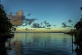 White Cumulostratus or Cumulus clouds over a lagoon on Samoa Royalty Free Stock Photo