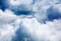 White cumulus clouds, blue sky background closeup, overcast skies backdrop, fluffy cloud texture beautiful rainy stormy cloudscape Royalty Free Stock Photo