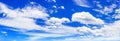 White cumulus clouds blue sky background panorama, beautiful cloudscape wide panoramic view, cloudy skies backdrop, fluffy cloud Royalty Free Stock Photo