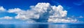 White cumulus clouds in blue sky over sea landscape, big cloud above ocean water panorama, seascape panoramic view, cloudy weather