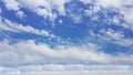 White cumulus clouds down to horizon on sunny day, suitable for background or sky substitution