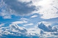 White cumulus clouds in the form of cotton wool on a blue sky. background, bright sky texture Royalty Free Stock Photo