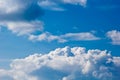 White cumulus clouds in the form of cotton wool on a blue sky. background, bright sky texture Royalty Free Stock Photo