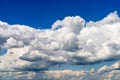White Cumulus Clouds And Grey Storm Clouds On Blue Sky Royalty Free Stock Photo