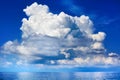 White cumulus clouds over sea close up blue sky background landscape, big fluffy cloud above ocean water panorama, cloudscape