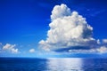 White cumulus clouds over sea close up blue sky background landscape, big fluffy cloud above ocean water panorama, cloudscape Royalty Free Stock Photo