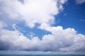 White cumulus clouds in sky over blue sea water landscape, big white cloud above ocean sea surface horizon Beautiful tropical Royalty Free Stock Photo