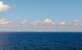 White cumulus clouds in sky over blue water of Gulf of Finland landscape