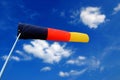 windsock white cumulus spring clouds in blue sky Royalty Free Stock Photo