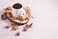 White Cup of acorn coffee on a wooden cut with acorns and oak leaves. Coffee substitute, close-up. Copy space Royalty Free Stock Photo