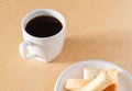 White cup of black coffee with biscuit Royalty Free Stock Photo