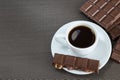 White cup with black coffee and chocolate