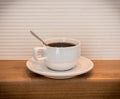 White cup of black coffee Horizontal