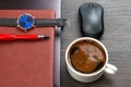 white cup of black coffee on the office table next to the laptop and business items. business and breakfast time Royalty Free Stock Photo