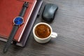 white cup of black coffee on the office table next to the laptop and business items. business and breakfast time Royalty Free Stock Photo