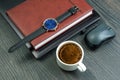 white cup of black coffee on the office table next to the laptop and business items. business and breakfast time Royalty Free Stock Photo
