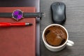 white cup of black coffee on the office table next to the laptop and business items. business and breakfast time Royalty Free Stock Photo