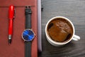 white cup of black coffee on the office table next to the laptop and business items. business and breakfast time Royalty Free Stock Photo