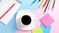 White cup with black coffee on a saucer, colour pencils, stickers Royalty Free Stock Photo