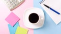 White cup with black coffee on a saucer, pen, stickers and calculator Royalty Free Stock Photo