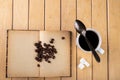 White cup with black coffee on a wooden table. Grains of coffee on an old book Royalty Free Stock Photo