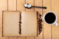 White cup with black coffee on a wooden table. Grains of coffee on an old book Royalty Free Stock Photo