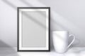 White cup and black frame on studio background. Empty mockup. Mug side view. Blank mockups with shadow. 3d cup front and and with Royalty Free Stock Photo